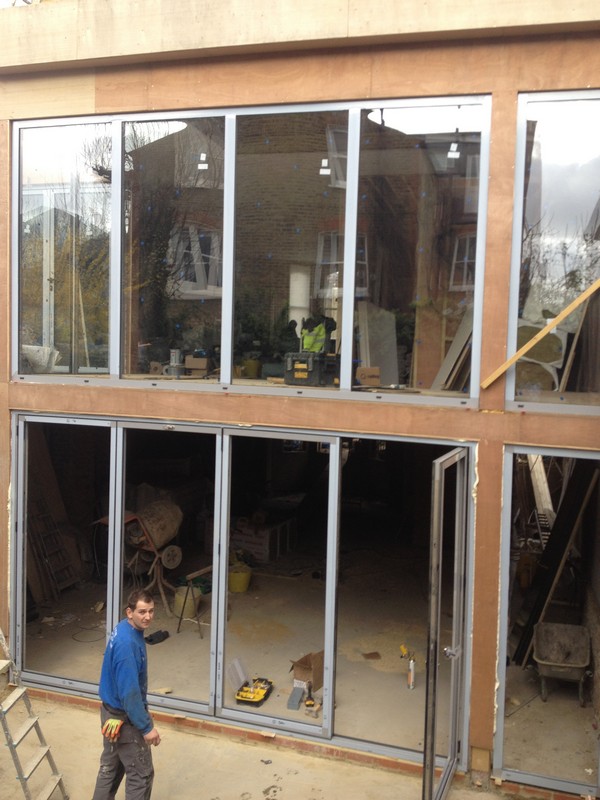 Aluminium bi-fold doors with two-storey glazing in Harrow