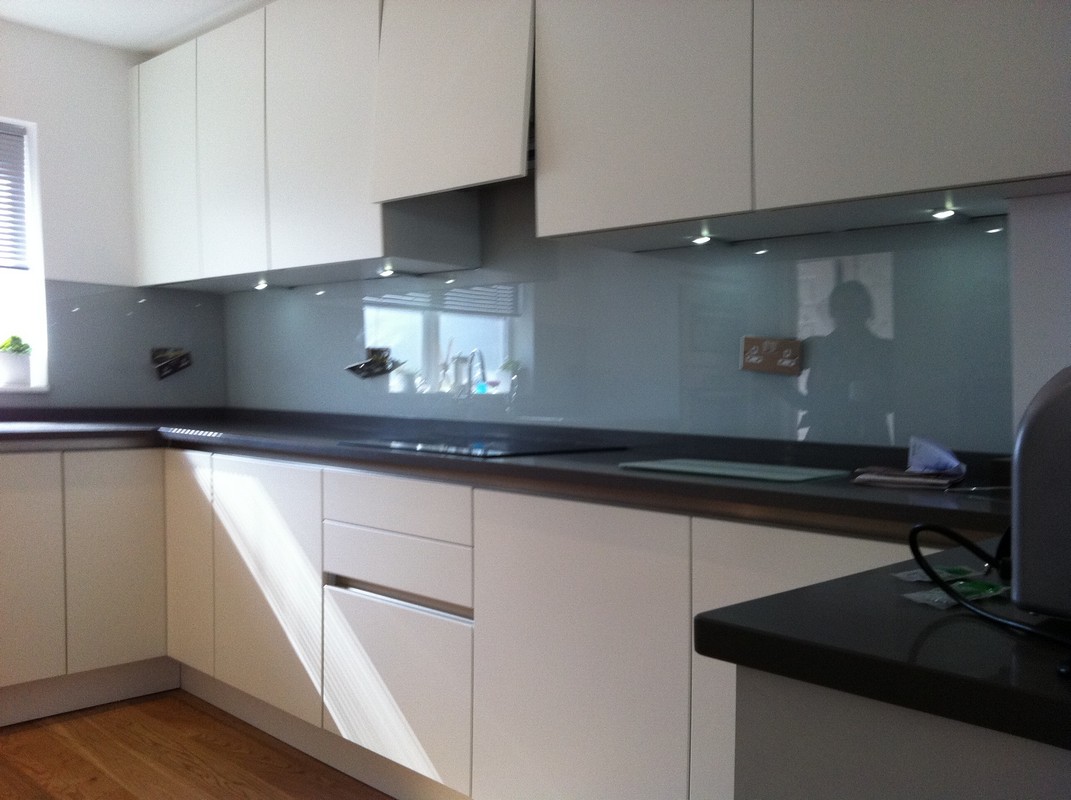 Grey glass kitchen splashback with LED lighting in Harrow