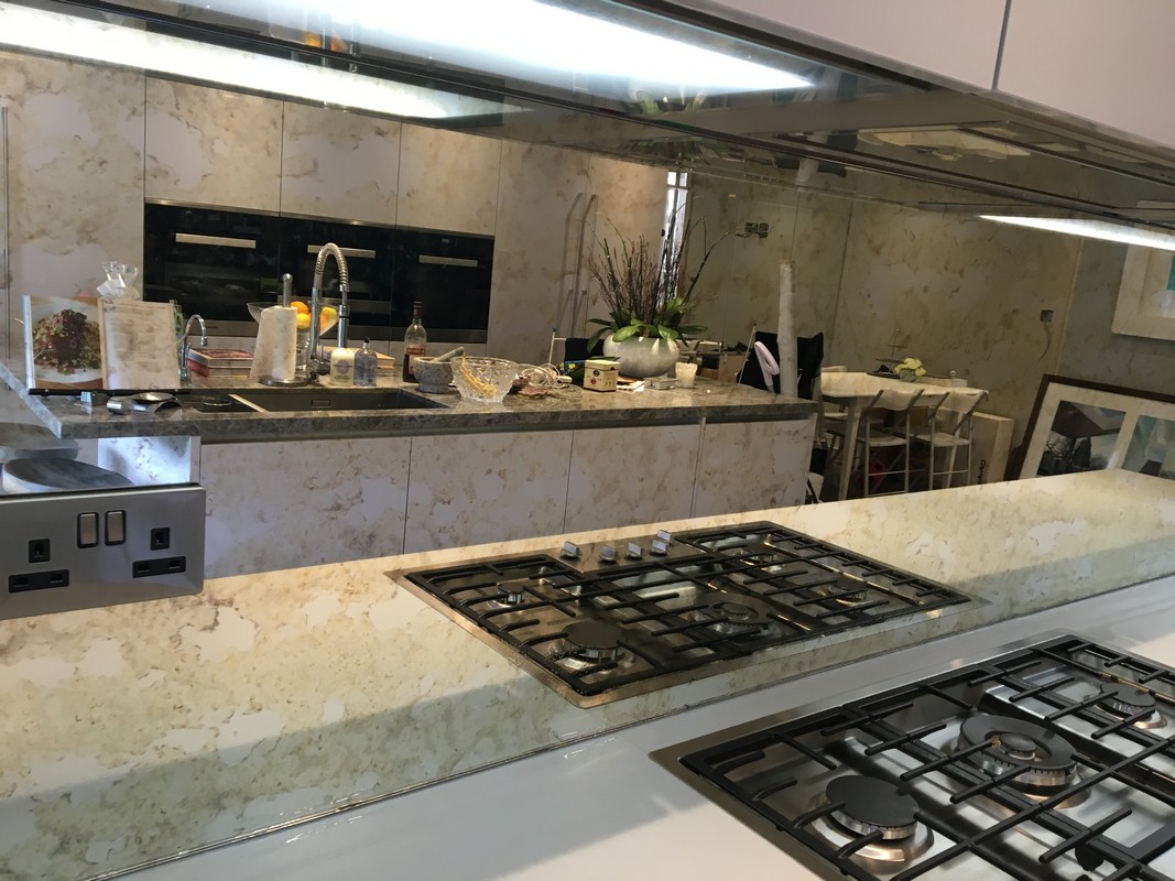 Mirror glass splashback in Harrow luxury kitchen
