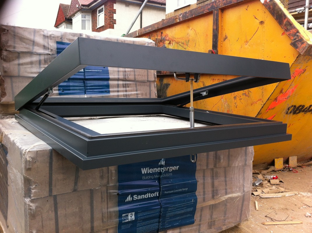 Opening flat roof skylight in anthracite grey installed in Harrow