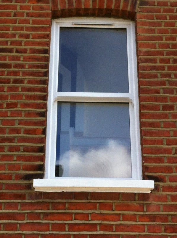 uPVC sash window on Victorian red brick house in Harrow